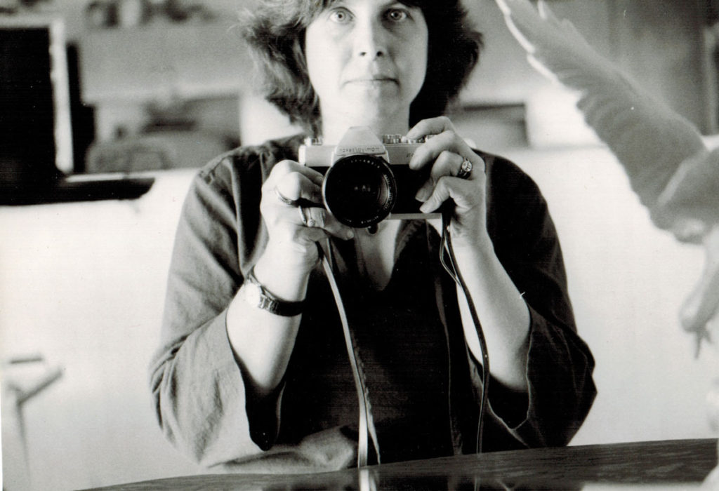 Photo of Kathryn Taylor holding a camera